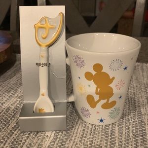 Disney’s unlock your imagination mug complete with the key as a stir